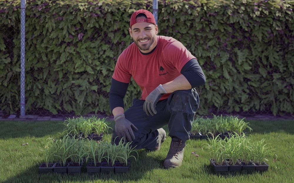 man in red gardening posing for picture